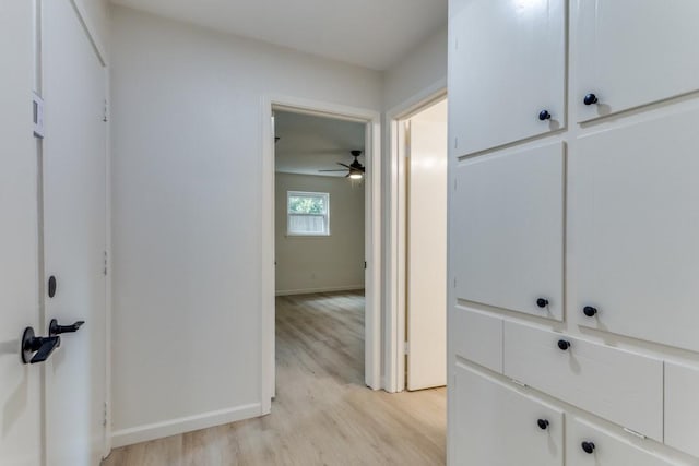 6148 Wrigley Way, Fort Worth, TX 76133 - hallway featuring light wood-type flooring and baseboards