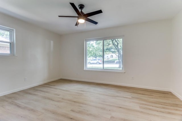 6148 Wrigley Way, Fort Worth, TX 76133 - unfurnished room with baseboards, a ceiling fan, and wood finished floors
