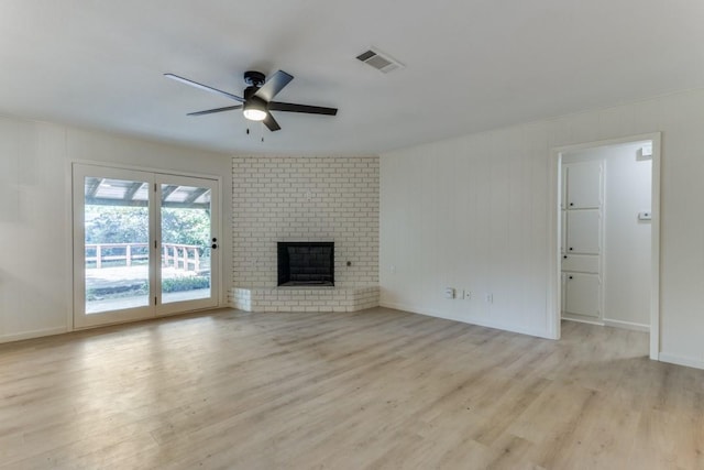 6148 Wrigley Way, Fort Worth, TX 76133 - unfurnished living room with ceiling fan, a brick fireplace, baseboards, light wood-type flooring, and visible vents
