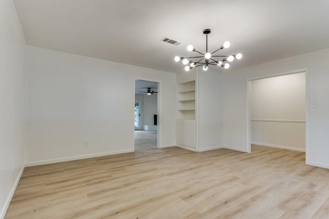 6148 Wrigley Way, Fort Worth, TX 76133 - empty room featuring light wood finished floors, built in shelves, ceiling fan with notable chandelier, baseboards, and visible vents