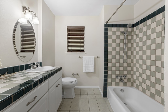 full bathroom featuring tile patterned floors, baseboards, vanity, toilet, and  shower combination