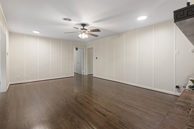 spare room featuring visible vents, a decorative wall, wood finished floors, recessed lighting, and a ceiling fan