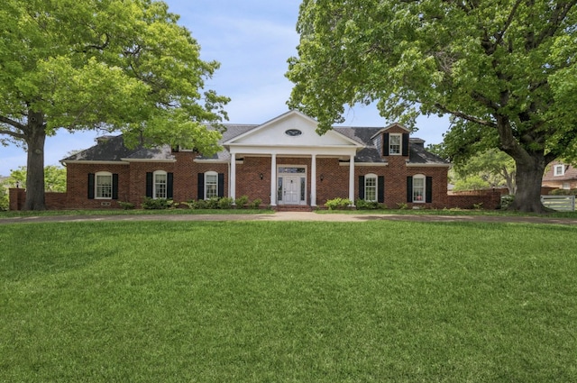 6555 Dartbrook Dr, Dallas, TX 75254 - greek revival inspired property with a front lawn and brick siding