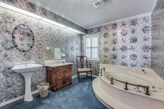 6555 Dartbrook Dr, Dallas, TX 75254 - bathroom with wallpapered walls, a textured ceiling, ornamental molding, a garden tub, and baseboards