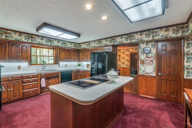 6555 Dartbrook Dr, Dallas, TX 75254 - kitchen featuring black appliances, wallpapered walls, a sink, dark colored carpet, and light countertops