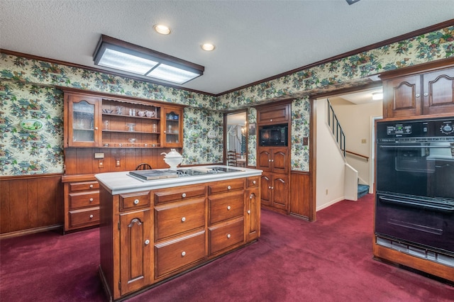 6555 Dartbrook Dr, Dallas, TX 75254 - kitchen featuring wallpapered walls, black appliances, a textured ceiling, dark carpet, and light countertops