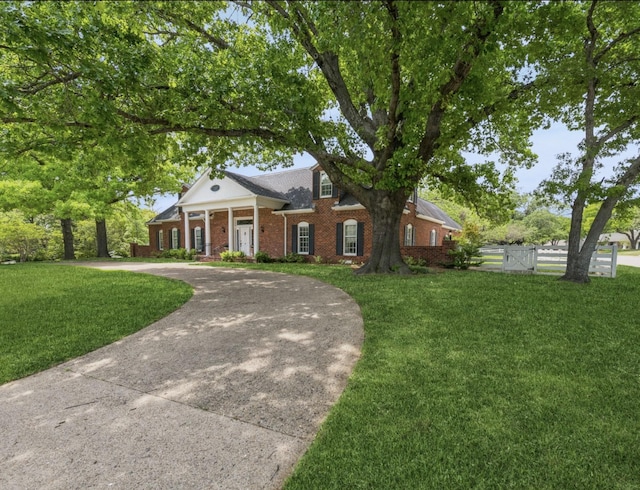6555 Dartbrook Dr, Dallas, TX 75254 - greek revival inspired property featuring curved driveway and brick siding