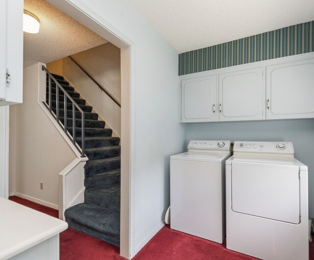 6555 Dartbrook Dr, Dallas, TX 75254 - washroom featuring washing machine and clothes dryer, cabinet space, dark carpet, a textured ceiling, and baseboards
