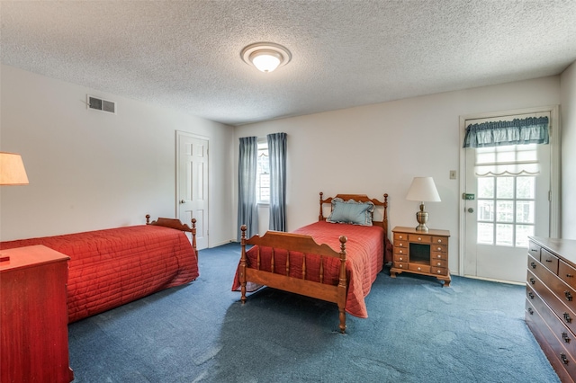 6555 Dartbrook Dr, Dallas, TX 75254 - carpeted bedroom featuring a textured ceiling