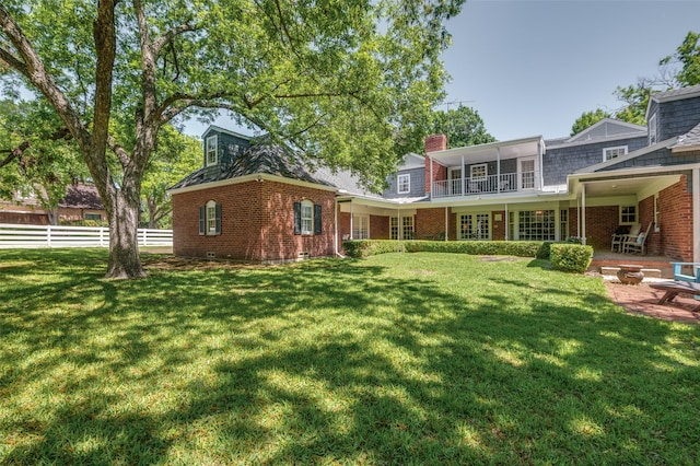 6555 Dartbrook Dr, Dallas, TX 75254 - back of property with brick siding, a patio, and a chimney