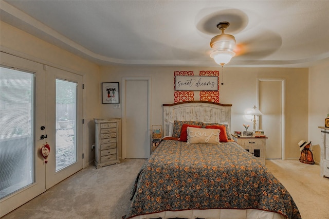 bedroom featuring ceiling fan, carpet, french doors, and access to exterior