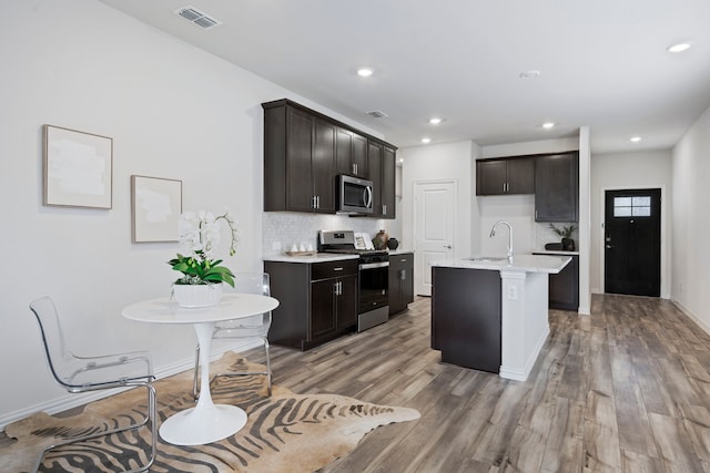 2021 Pine Stone Ln, Forney, TX 75126 - kitchen with backsplash, appliances with stainless steel finishes, a sink, and visible vents