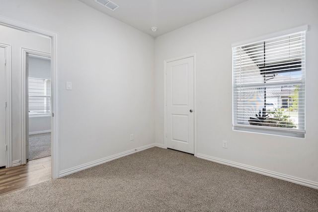 2021 Pine Stone Ln, Forney, TX 75126 - unfurnished room with baseboards, carpet, and visible vents