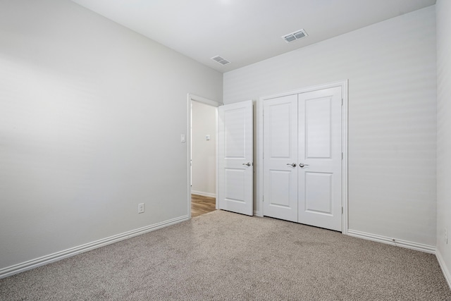 2021 Pine Stone Ln, Forney, TX 75126 - unfurnished bedroom featuring visible vents, carpet, baseboards, and a closet