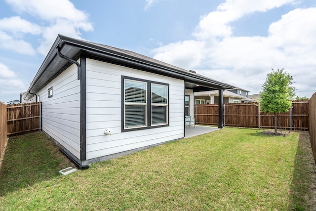 2021 Pine Stone Ln, Forney, TX 75126 - rear view of house with a fenced backyard, a patio area, and a yard