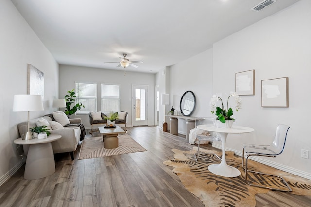 2021 Pine Stone Ln, Forney, TX 75126 - living area with baseboards, visible vents, and wood finished floors
