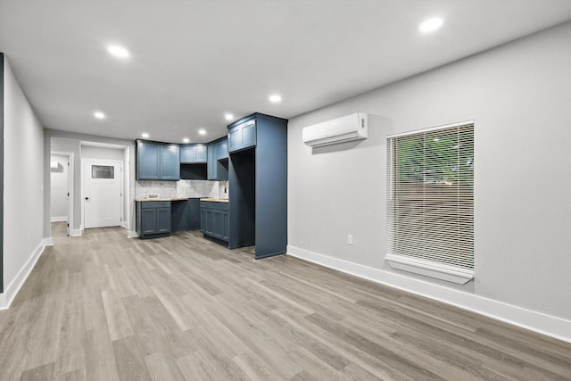 217 N Hawkins St, Waxahachie, TX 75165 - unfurnished living room featuring baseboards, a wall mounted AC, recessed lighting, and a heating unit