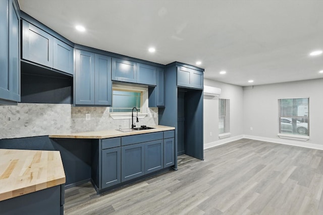 217 N Hawkins St, Waxahachie, TX 75165 - kitchen featuring recessed lighting, butcher block countertops, a sink, and tasteful backsplash