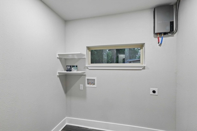 217 N Hawkins St, Waxahachie, TX 75165 - clothes washing area featuring hookup for an electric dryer, washer hookup, baseboards, and laundry area