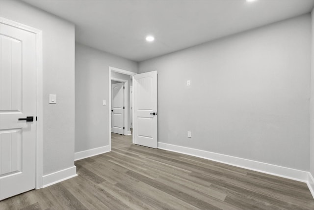 217 N Hawkins St, Waxahachie, TX 75165 - unfurnished room featuring baseboards, recessed lighting, and wood finished floors