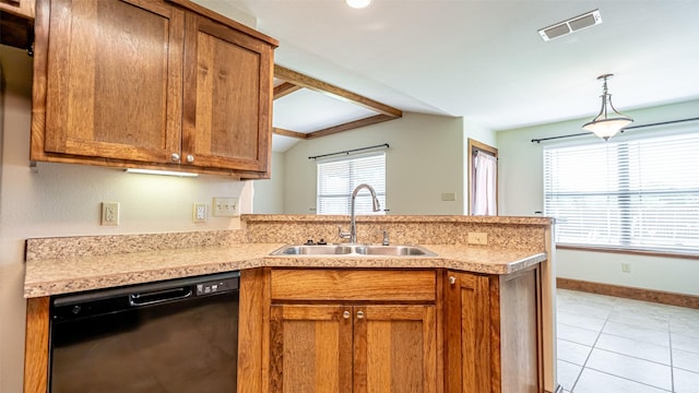 630 N Park St, Dublin, TX 76446 - kitchen with dishwasher, a sink, a peninsula, brown cabinets, and light countertops