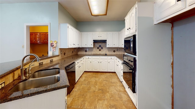 kitchen featuring a sink, backsplash, black appliances, and white cabinetry
