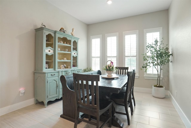 2107 Demarsh Ln, Corinth, TX 76210 - dining room with light tile patterned flooring and baseboards