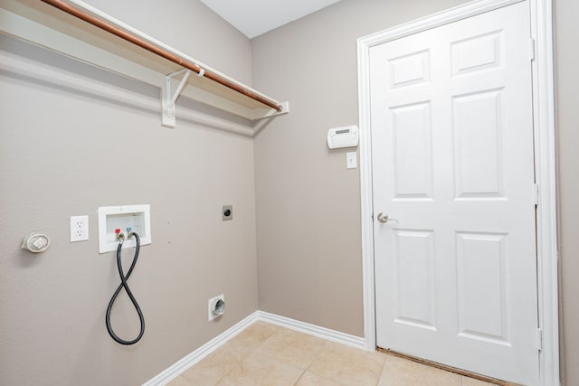 laundry room with hookup for an electric dryer, laundry area, light tile patterned floors, baseboards, and hookup for a washing machine
