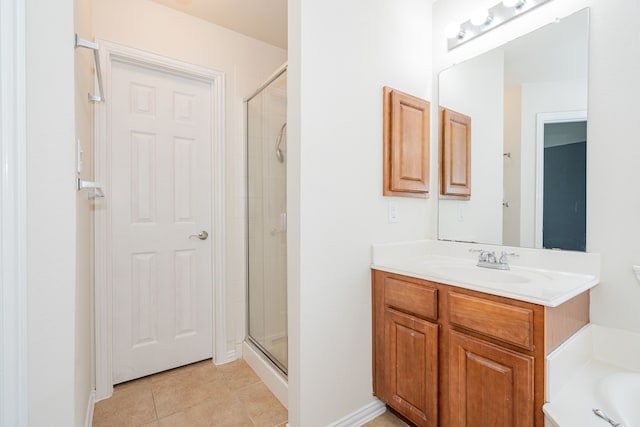 full bath featuring tile patterned flooring, a stall shower, vanity, a bathing tub, and baseboards