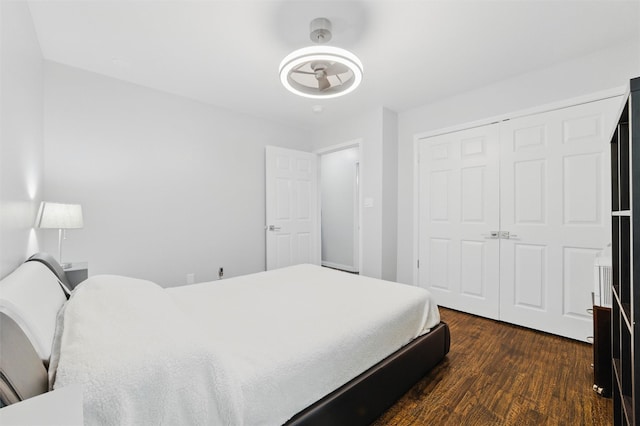 5243 Welden Ct, Fort Worth, TX 76132 - bedroom featuring a closet and dark wood-style flooring