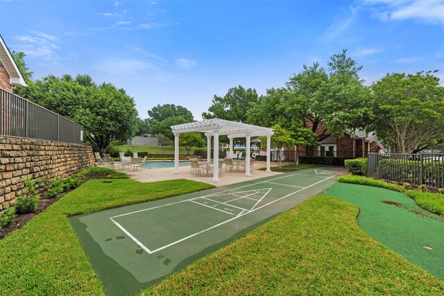5243 Welden Ct, Fort Worth, TX 76132 - view of community featuring fence, a pergola, shuffleboard, a lawn, and a swimming pool