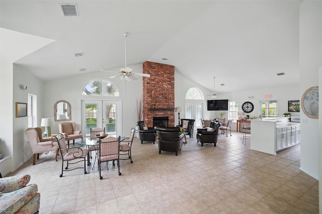5243 Welden Ct, Fort Worth, TX 76132 - dining room with a brick fireplace, a ceiling fan, visible vents, and a healthy amount of sunlight