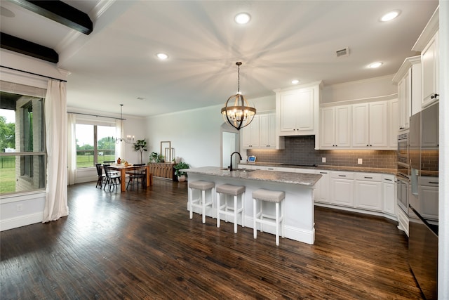 235 Winchester St, Van Alstyne, TX 75495 - kitchen with a sink, a chandelier, ornamental molding, and stainless steel appliances