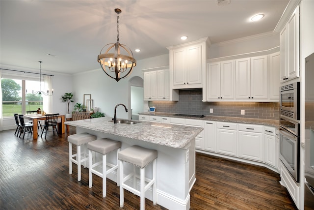 235 Winchester St, Van Alstyne, TX 75495 - kitchen with an inviting chandelier, a sink, appliances with stainless steel finishes, and ornamental molding