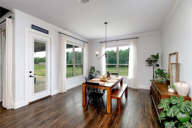 235 Winchester St, Van Alstyne, TX 75495 - dining area with crown molding, baseboards, dark wood-style floors, and a notable chandelier