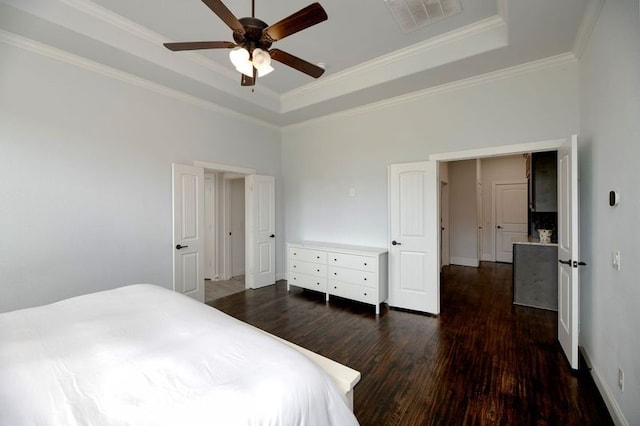 235 Winchester St, Van Alstyne, TX 75495 - bedroom with visible vents, dark wood finished floors, crown molding, and a tray ceiling