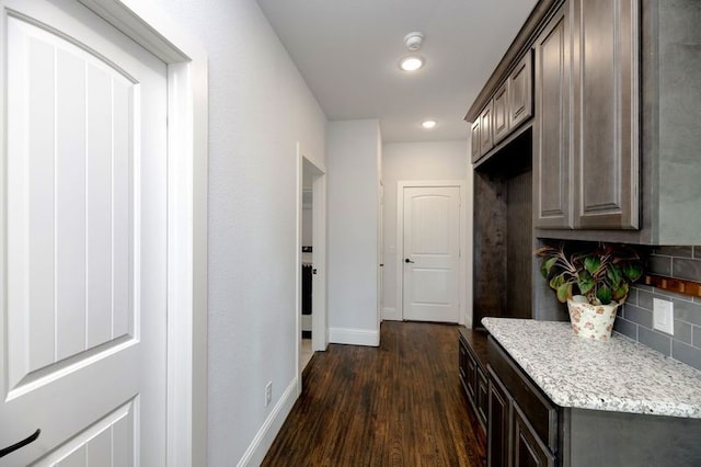 235 Winchester St, Van Alstyne, TX 75495 - corridor with dark wood-style flooring, baseboards, and recessed lighting