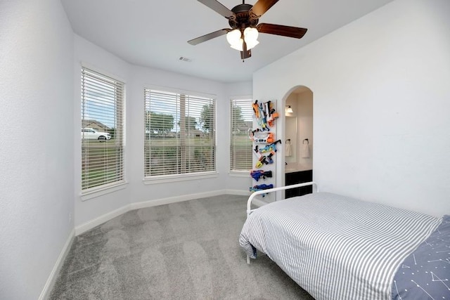 235 Winchester St, Van Alstyne, TX 75495 - carpeted bedroom with arched walkways, baseboards, ceiling fan, and visible vents