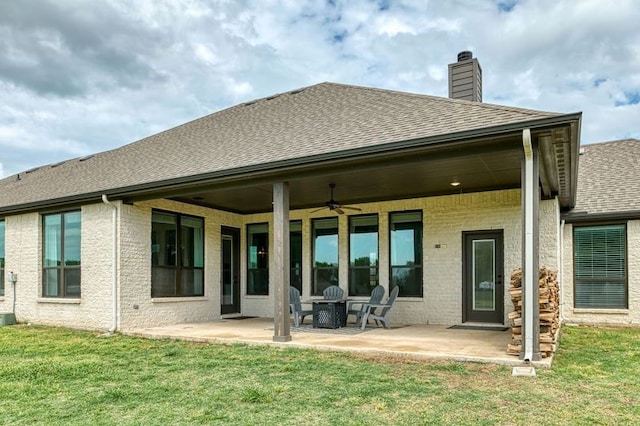 235 Winchester St, Van Alstyne, TX 75495 - back of house with ceiling fan, a patio, a chimney, a shingled roof, and a lawn