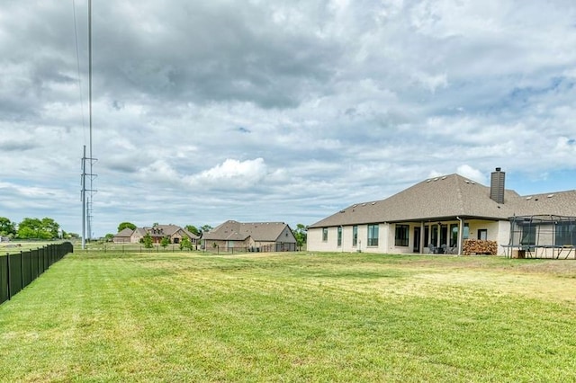 235 Winchester St, Van Alstyne, TX 75495 - view of yard featuring fence and a trampoline