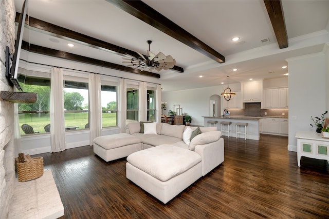 235 Winchester St, Van Alstyne, TX 75495 - living area featuring dark wood-style flooring, a notable chandelier, recessed lighting, and beam ceiling