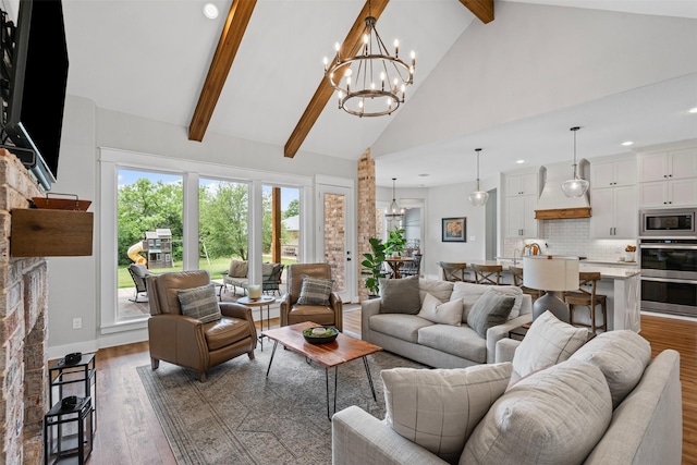living room with a notable chandelier, high vaulted ceiling, recessed lighting, wood finished floors, and beamed ceiling