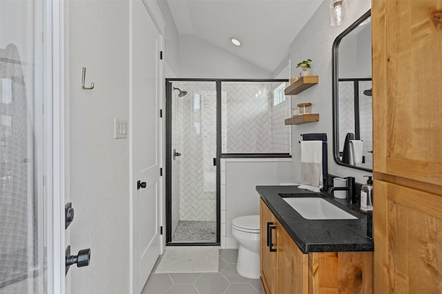 bathroom featuring vanity, lofted ceiling, toilet, tile patterned floors, and a shower stall