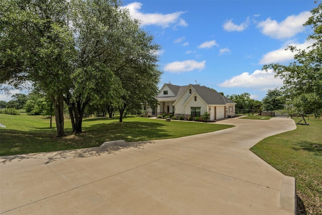 view of front facade featuring an attached garage, a front lawn, board and batten siding, and driveway