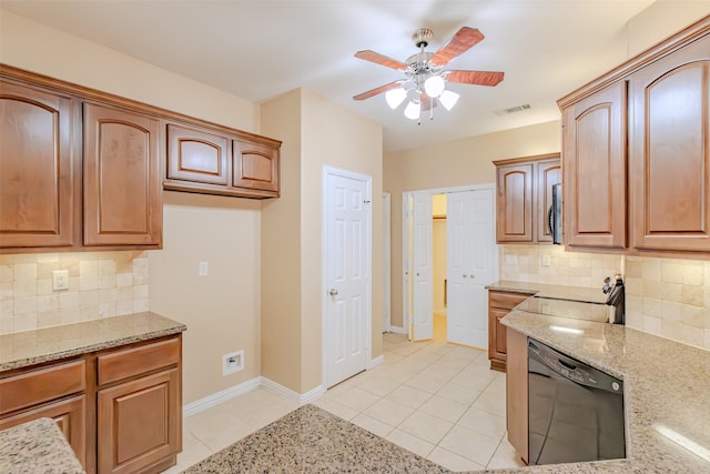 kitchen with visible vents, light stone countertops, light tile patterned flooring, and dishwasher