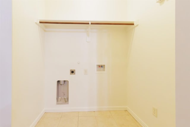 washroom with gas dryer hookup, washer hookup, hookup for an electric dryer, laundry area, and baseboards