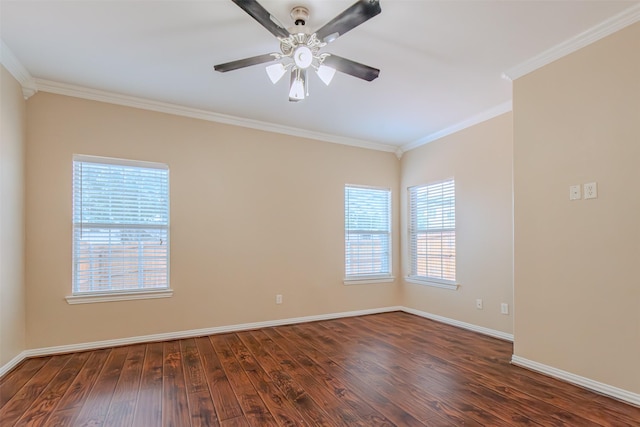 spare room featuring baseboards, ornamental molding, a ceiling fan, and wood finished floors