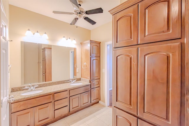 full bathroom featuring a sink, tile patterned floors, ceiling fan, and double vanity