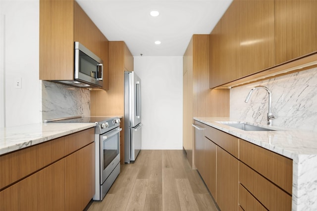 3831 Turtle Creek Blvd Unit 7E, Dallas, TX 75219 - kitchen with a sink, appliances with stainless steel finishes, light stone countertops, and tasteful backsplash