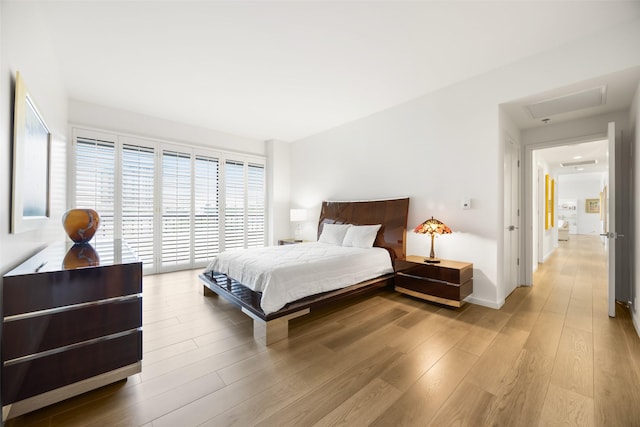 3831 Turtle Creek Blvd Unit 7E, Dallas, TX 75219 - bedroom with wood finished floors
